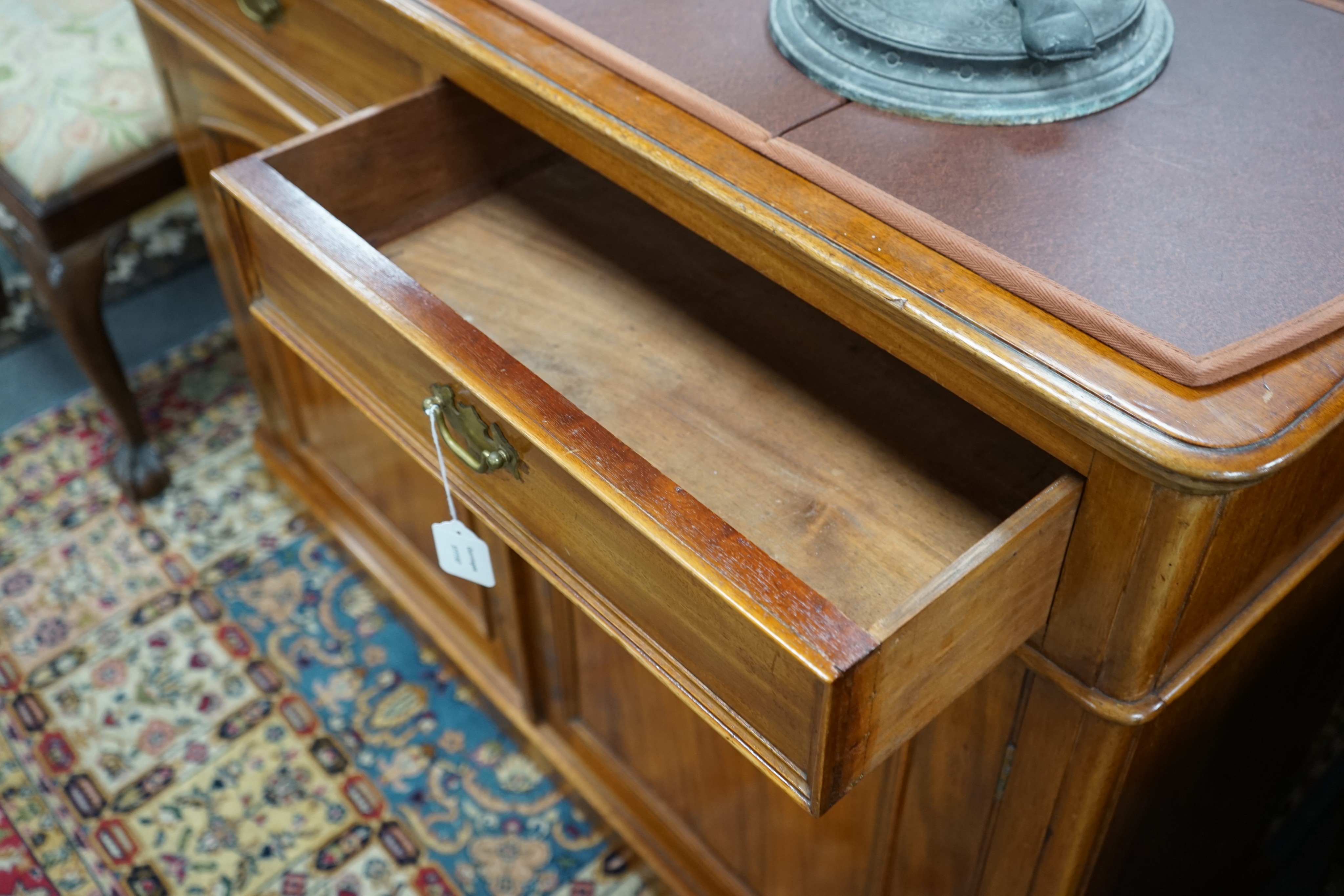 A Victorian mahogany side cabinet with two drawers over a pair of panelled doors, width 120cm, depth 44cm, height 87cm